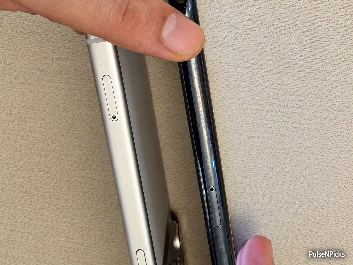 Comparing the SIM tray positions on the old and new iPhone