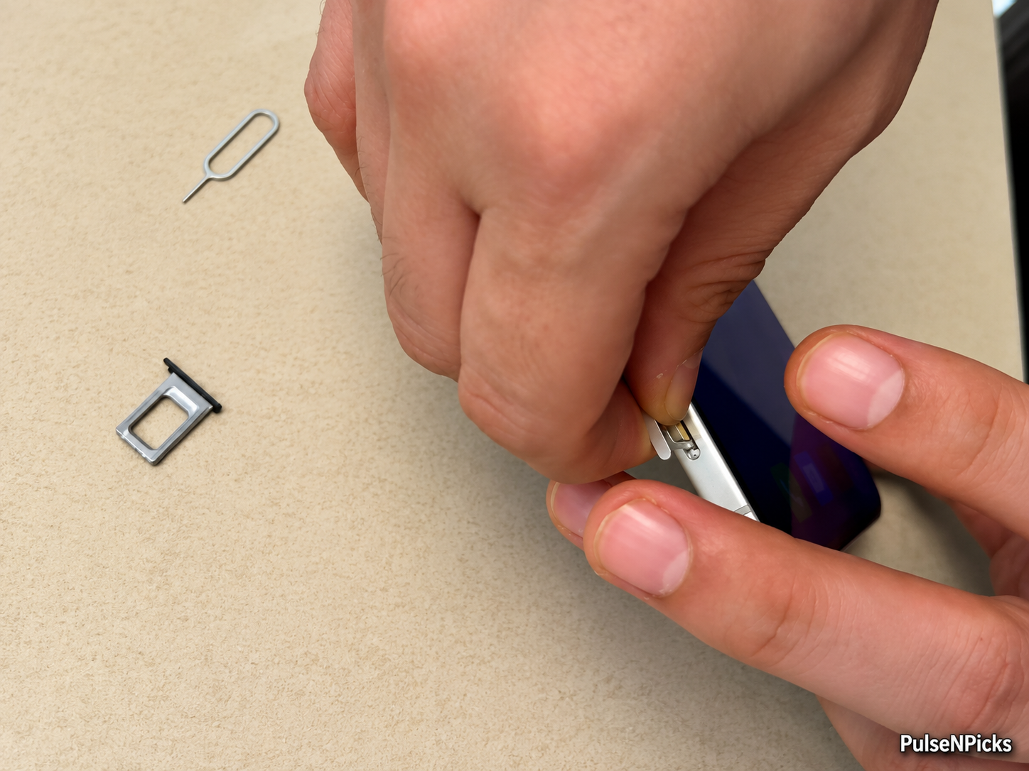 iPhone SIM tray shown during phone number transfer