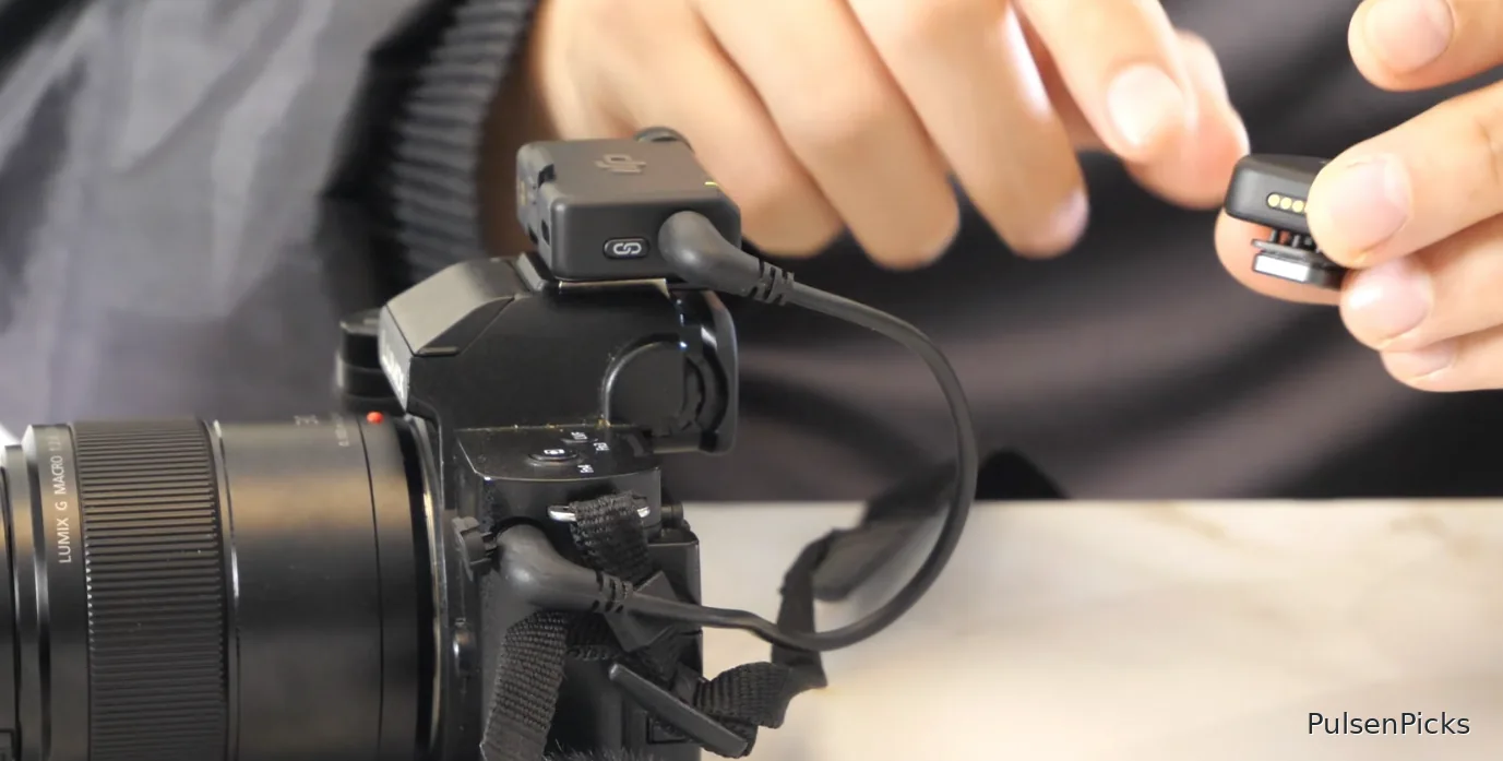 DJI Mic Mini receiver connected to Panasonic Lumix camera via 3.5mm microphone cable