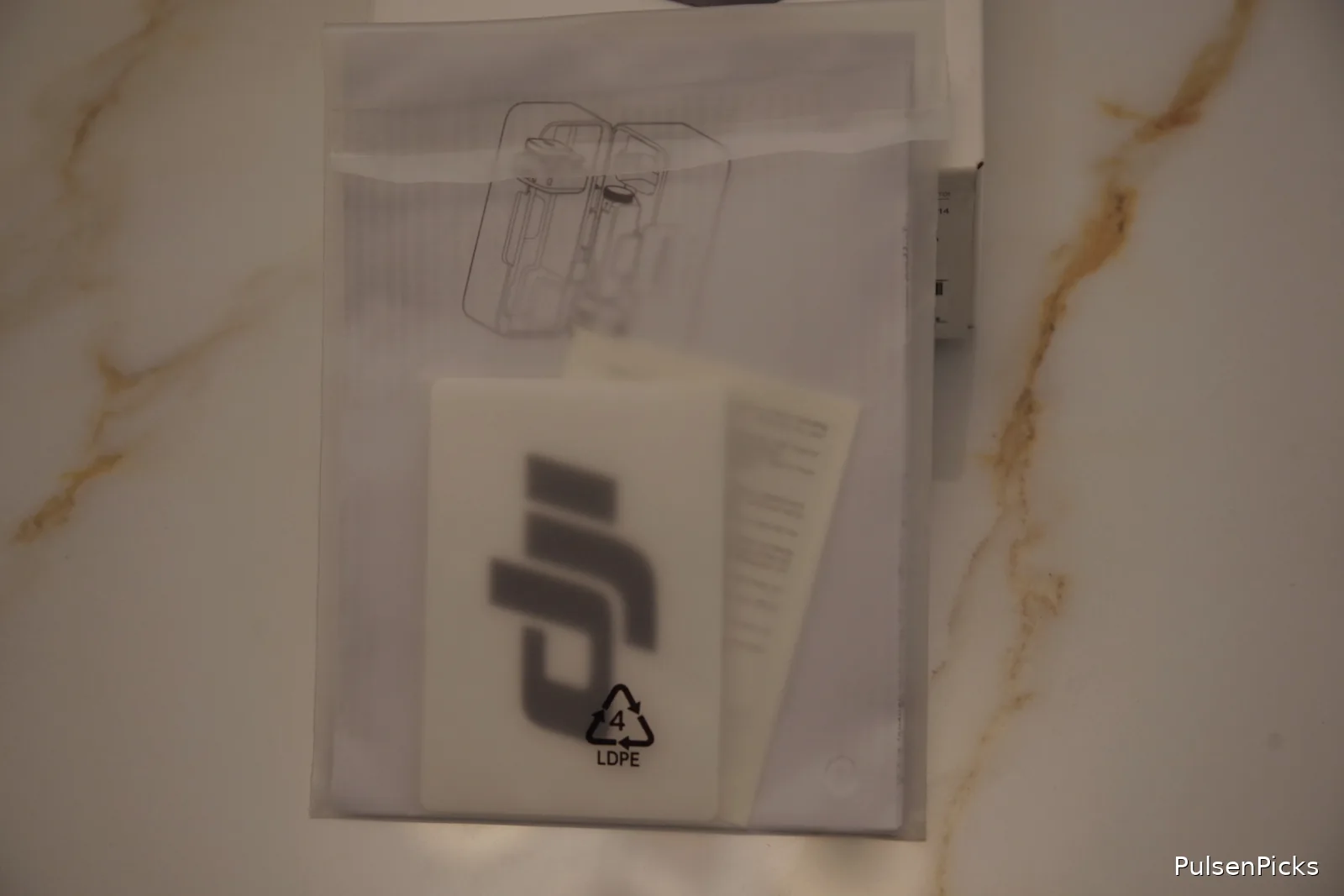 DJI Mic Mini instruction guides and paperwork included in retail box