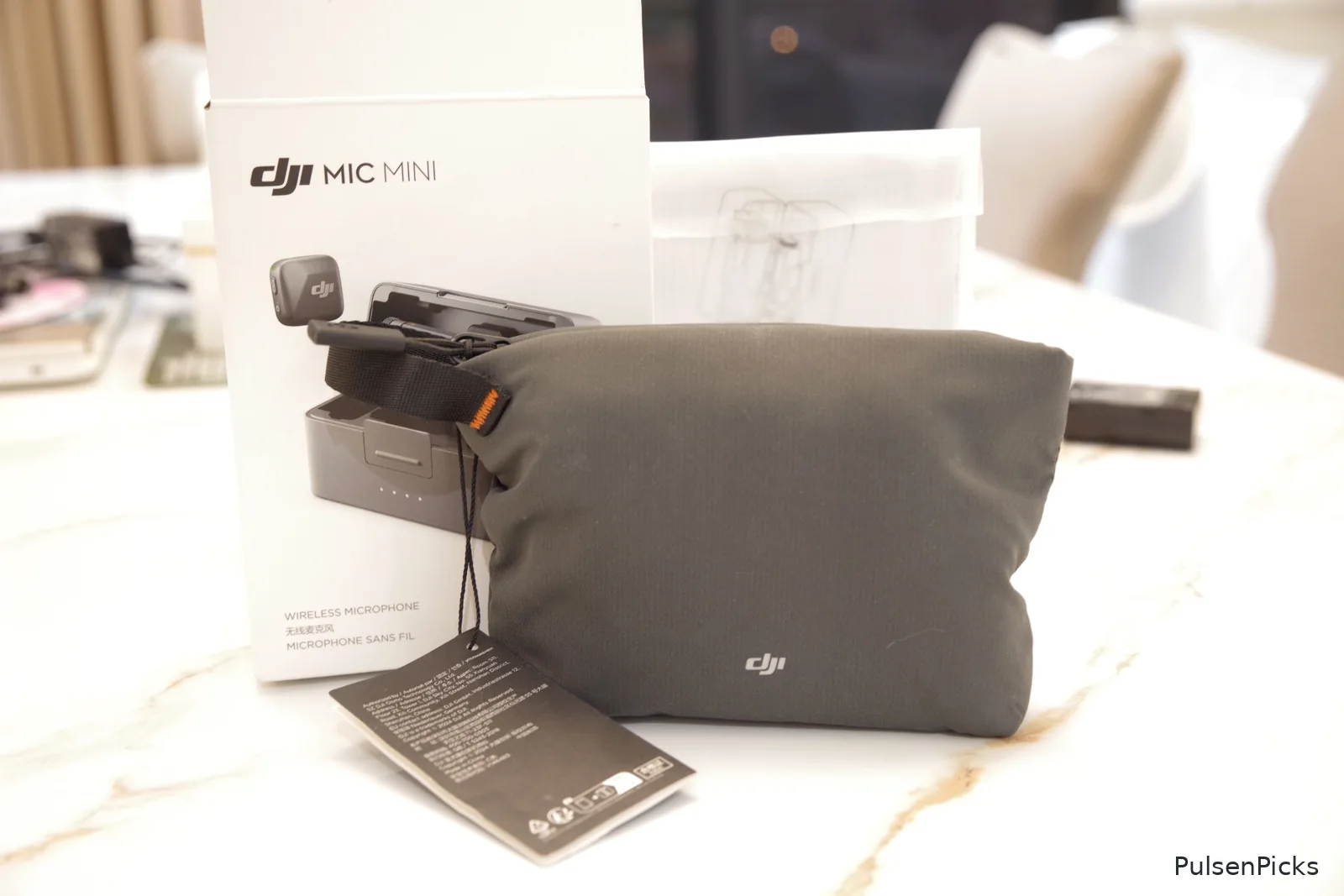DJI Mic Mini packaging and included grey carrying pouch