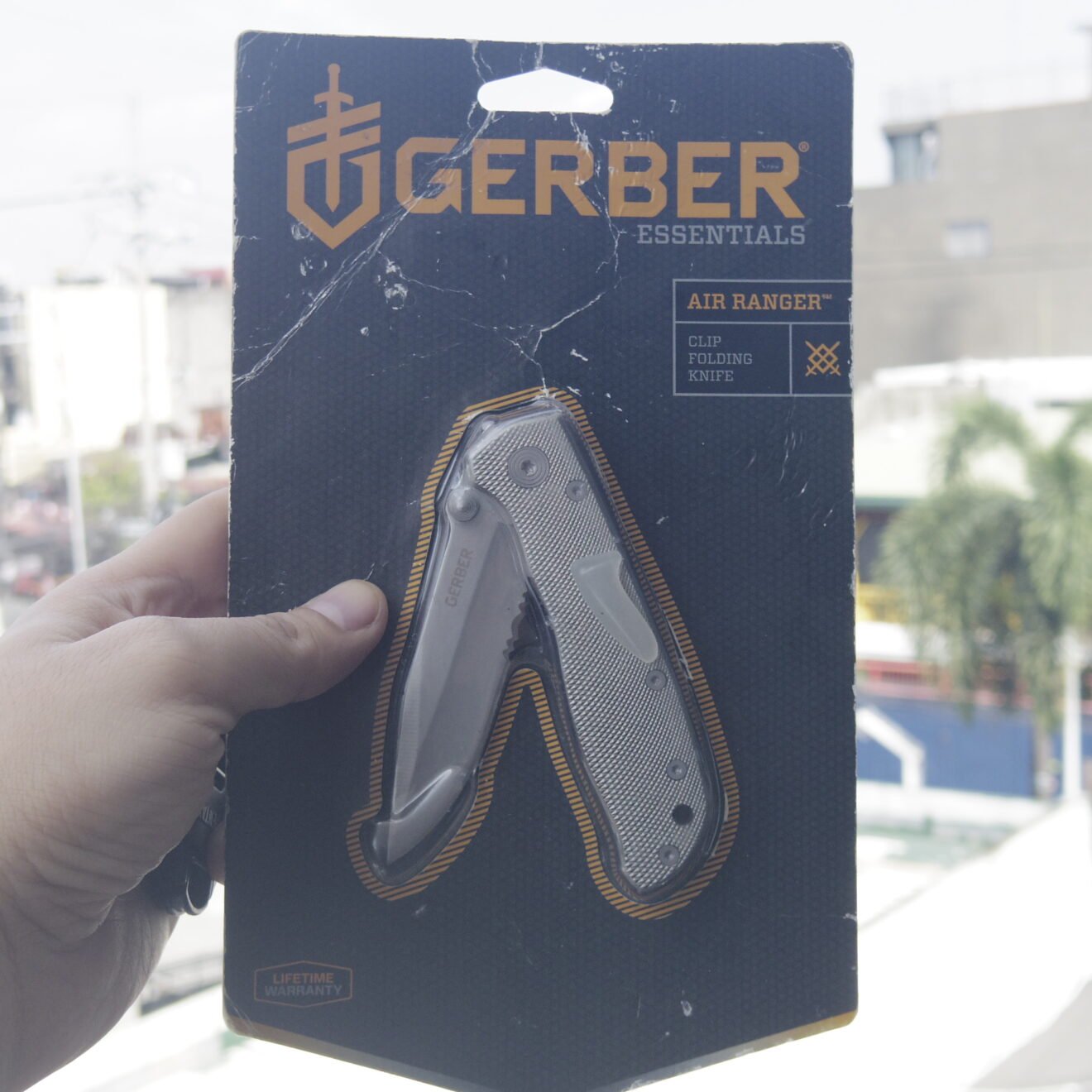 Gerber Air Ranger packaged lightweight aluminum folding knife held outdoors