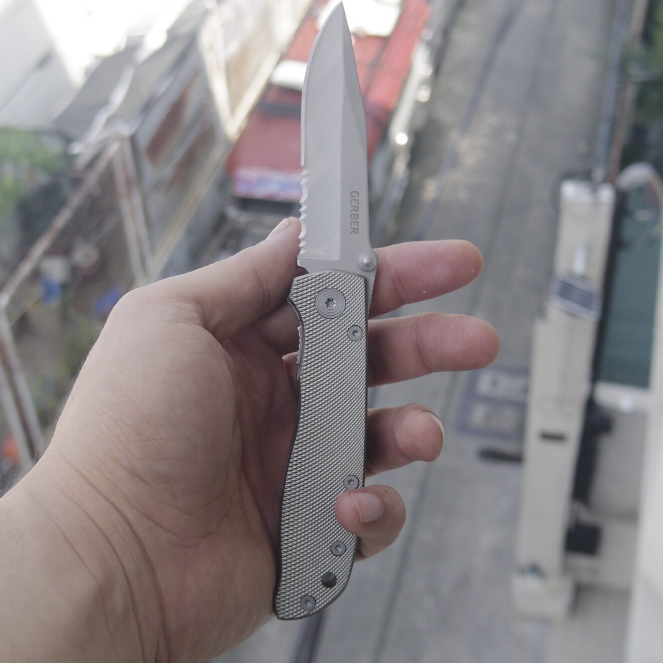 Gerber Air Ranger opened seen edge-on with slender blade and open-back frame construction