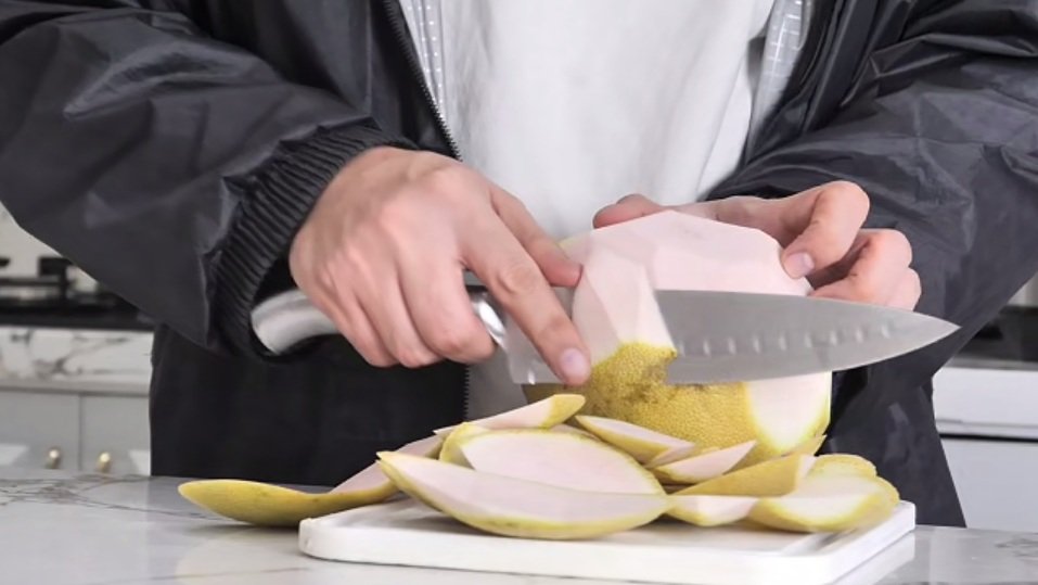 Hessler Gourmet chef knife cutting fruit in our hands-on review