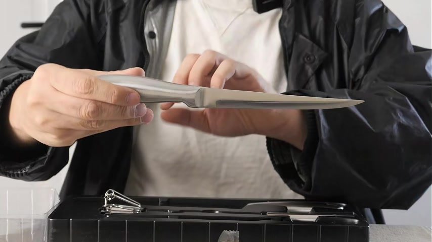Hands-on video close-up of Hessler chef knife and metal handle